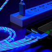 GlowCharge 3-in-1 LED fast charging cable with USB-C, Lightning, and Micro USB connectors.
